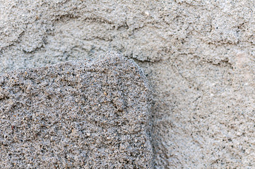 Brick wall. Broken plaster. Cracked and corroded cement.