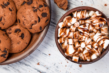 Hot chocolate with marshmallow and chocolate cookies. Flat lay.