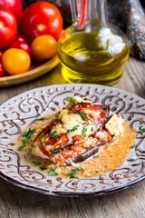 Parmigiano with tomatoes, eggplant, cheese, meat, chicken, traditional dish, tasty homemade food