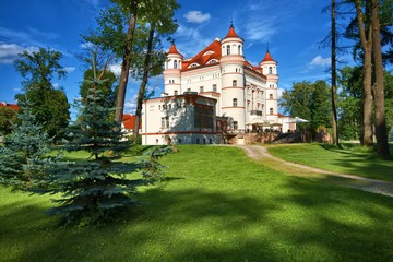 Neo-Gothic style palace surrounded by an English landscape garden in Wojanow, Poland