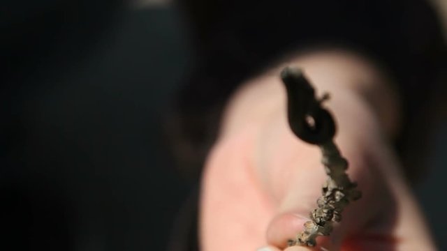woman shows a centipedes with a twig