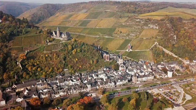Flight over Bacharach town and autumn vineyards, Rhine Valley, Germany.