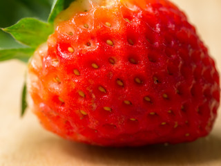 Close up of strawberry on wood.