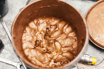gold paint in bucket