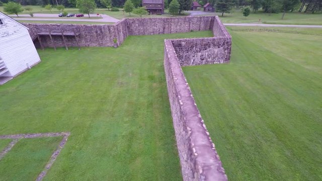 Aerial view of the Fort Frederick barracks with the Calvert Arms flag waving in the breeze.