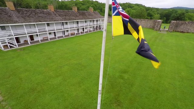 Aerial view of the Fort Frederick barracks with the Calvert Arms flag waving in the breeze.