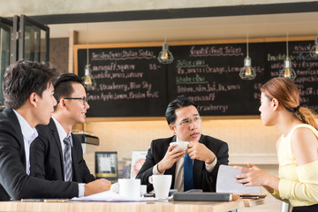 Businesspeople discussing together in conference room during meeting at office
