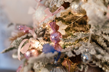 Christmas decorations on the snow-covered spruce branches
