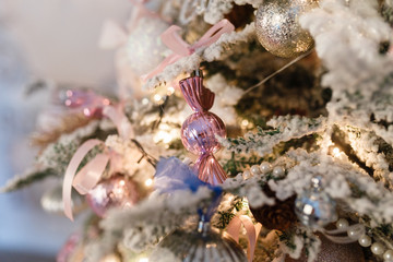 Christmas decorations on the snow-covered spruce branches