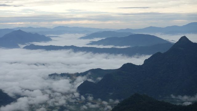 Phu Chi Fa forest park and mountain at sunrise with sea of fog in morning, Landmark of Chiang Rai, Thailand, Time lapse video footage
