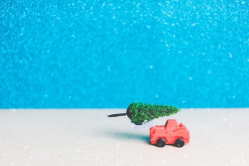 Christmas tree on miniature car. Christmas seasons celebration concept