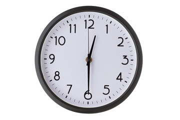 Round office wall clock on white, half past twelve