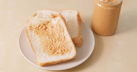 Makes a peanut butter sandwich
