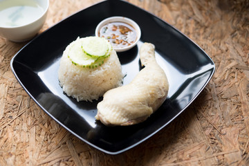 Hainanese chicken rice with soup and sauce