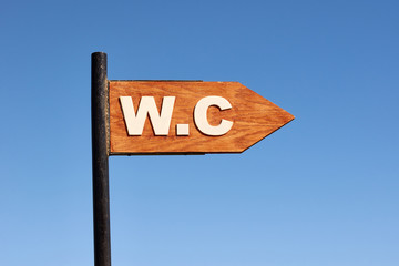 public toilet sign at the sea beach.