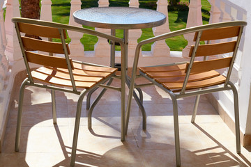 Scenic cafe table and chairs on the balcony