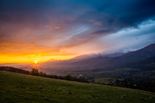 Sunset over peak Havran and Zakopane in Tatra mountains from Koscielisko, Poland