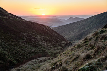 Beautiful autumn scenery in the Peak District - sun rising in the far end of the frame, creating impressive perspective