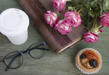 Vintage notebook mock up for artwork with pink roses. Place for text. Fresh flowers. Coffee to go and cake.