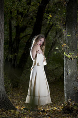 Obraz na płótnie Canvas Fantasy Fairy Tale Forest , young woman posing as nymph