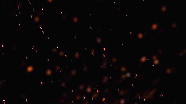 ultra slow motion high speed shot of fire flames and glowing ashes on black background