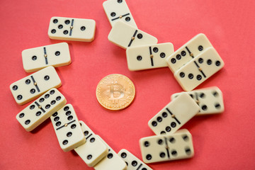 Financial system crash. Chaos. Finance system error. destroyed dominoes with golden bitcoin.