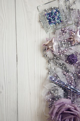 christmas background with holiday decorations on white wood background and copy space