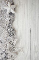 christmas background with holiday decorations on white wood background and copy space
