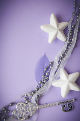 holiday decorations on lilac background and copy space
