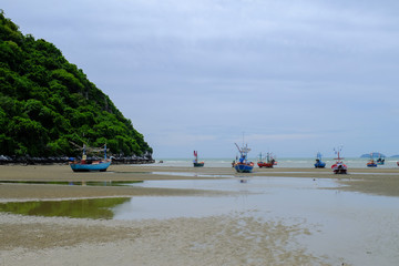 Seaside beach with blue sky., beautiful sand, small boat., Holiday concept., with copy space for text. in thailand.