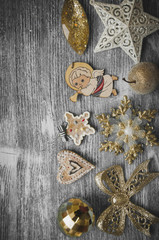 holiday ornaments on gray wood background and copy space