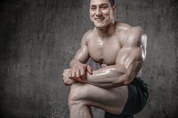 Fototapeta premium Handsome model young man posing in gym