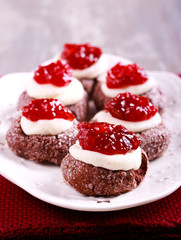 Chocolate, jam and cream thumbprints cookies