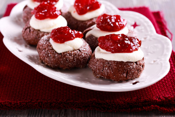 Chocolate, jam and cream thumbprints cookies