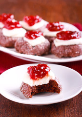 Chocolate, jam and cream thumbprints cookies