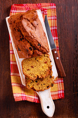 Fruit pumpkin bread, sliced on board