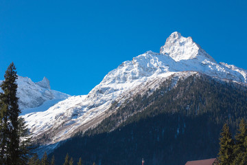 Winter mountains with high peaks.