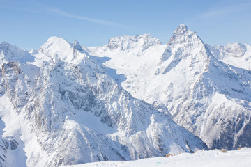 Fototapeta na wymiar Winter mountains with high peaks.