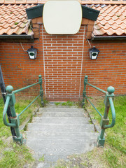 Curious staircase with brick door