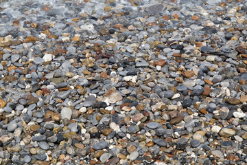 Colourful stones pebbles on a Mediterranean sea shore