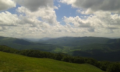 Obraz premium hills forest clouds sky grass