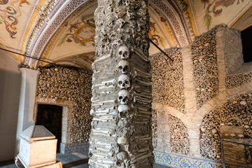 Evora, Portugal, August 17, 2017: Capela dos Ossos was built in the 16th century by a Franciscan monk to prod his fellow brothers into contemplation and transmit the message of life being transitory. - obrazy, fototapety, plakaty