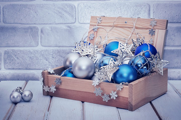A decorative balls in a wooden box. Сhristmas and new year concept.
