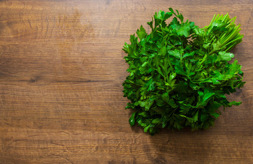 Fresh parsley on a wooden background. with copy space. top view