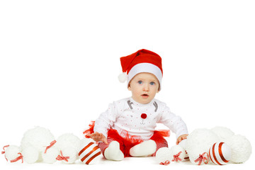 Beautiful funny baby in a Christmas hat isolated on white