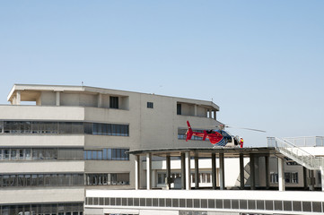 Helicopter on rooftop ready to take off