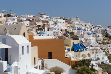 Fototapeta na wymiar Landscape panorama with white houses and ancient wind mill in the Santorini, Oia, Greece