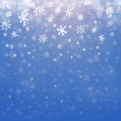 Naklejka na ściany i meble Christmas winter abstract background with snowflakes, bokeh lights and place for text. Christmas New Year's wallpaper