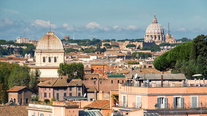 Sunny roofs of Rome and Saint Peters basilica in Vatican, Italy