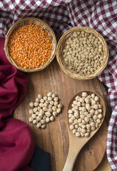 Variety Of Legumes And Grains On A Wooden Surface